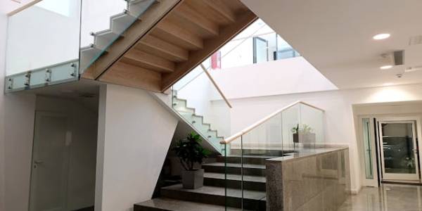 indoor staircase with glass railings